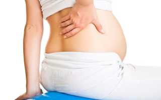Болит спина в одном месте при беременности